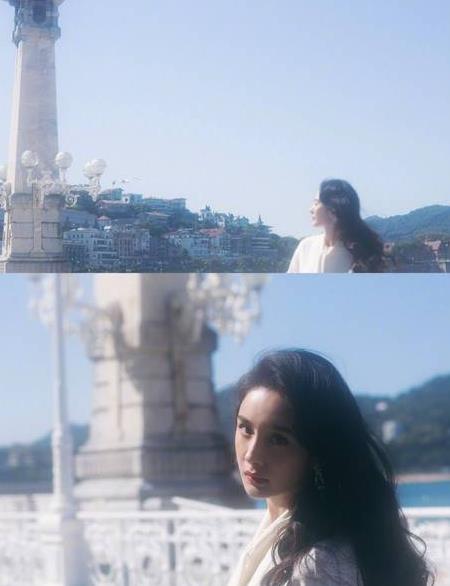 杨幂撩发风情万种：白连衣裙气质优雅女人味十足