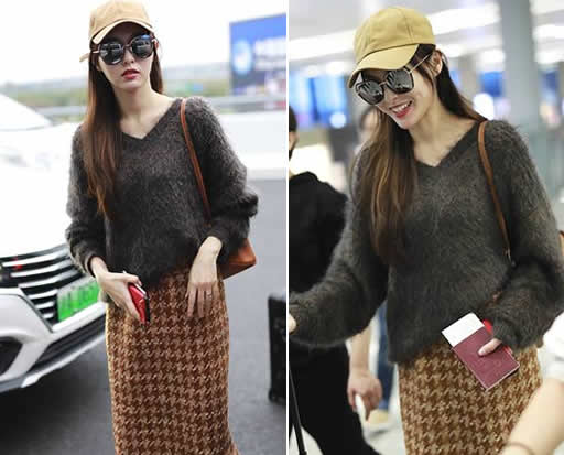 唐嫣婚后首现身机场：墨镜遮面秀钻戒 （图）