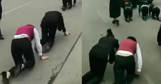 <b>女员工街头集体跪地爬行 滕州警方：商家为吸引眼球</b>
